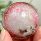 Rhodonite in Quartz Sphere Peru Healing Crystal Ball 102g 40mm